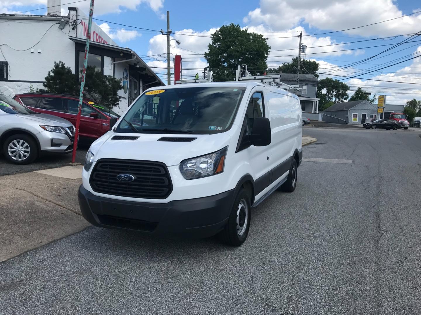 2018 White /Gray Ford Transit 150 Low Roof (1FTYE1YM7JK) with an 3.7 V6 engine, Automatic transmission, located at 577 Chester Pike, Prospect Park, PA, 19076, (610) 237-1015, 39.886154, -75.302338 - 2018 Ford Transit 150 Low Roof: Double drop down ladder racks, multiple pieces of shelving, heavy duty partition, new PA inspection, FLEET MAINTAINED, runs LIKE NEW! This vehicle comes inspected and has been given a bumper to bumper safety check. It is very clean, reliable, and well maintained. W - Photo#2